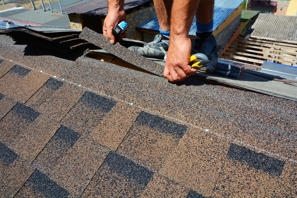 A guy working on his new roof.