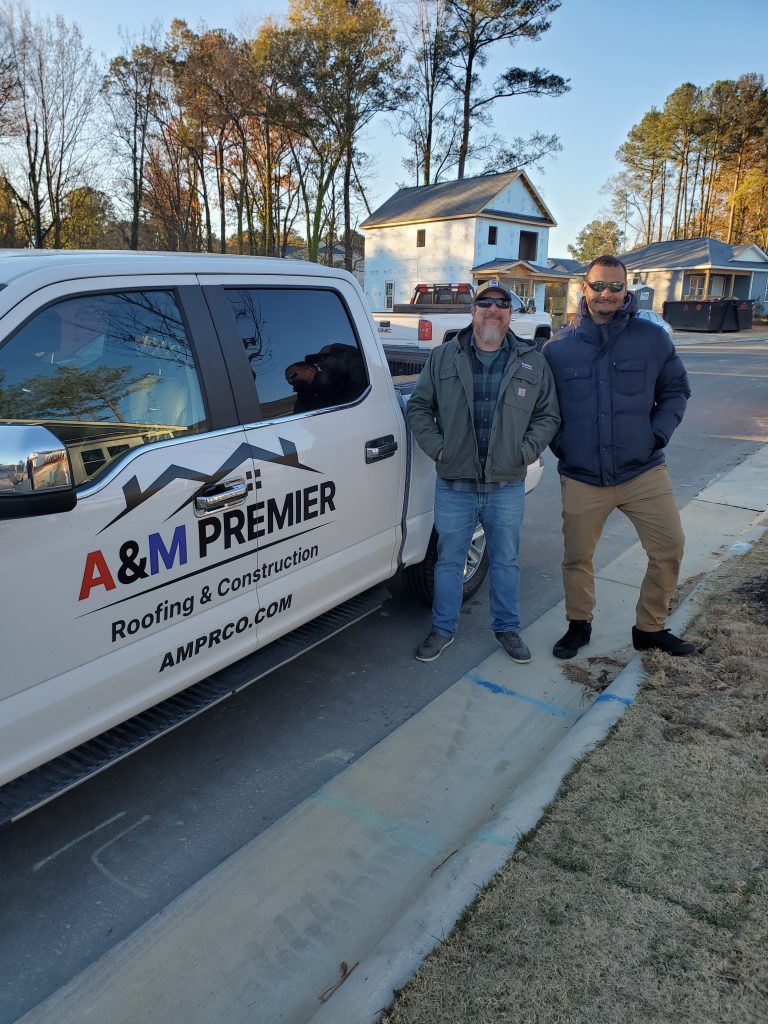 A&M Premier Production Manager, Alexi Velez and Habitat for Humanity of Wake County, VP of Construction Brad McHugh