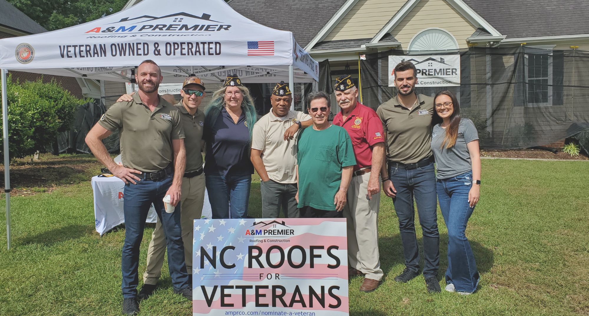 A&M Premier team joins local Veterans to present a free roof.