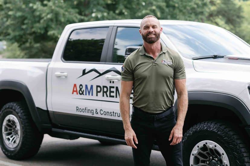 Stephen in front of an A&M Premier truck