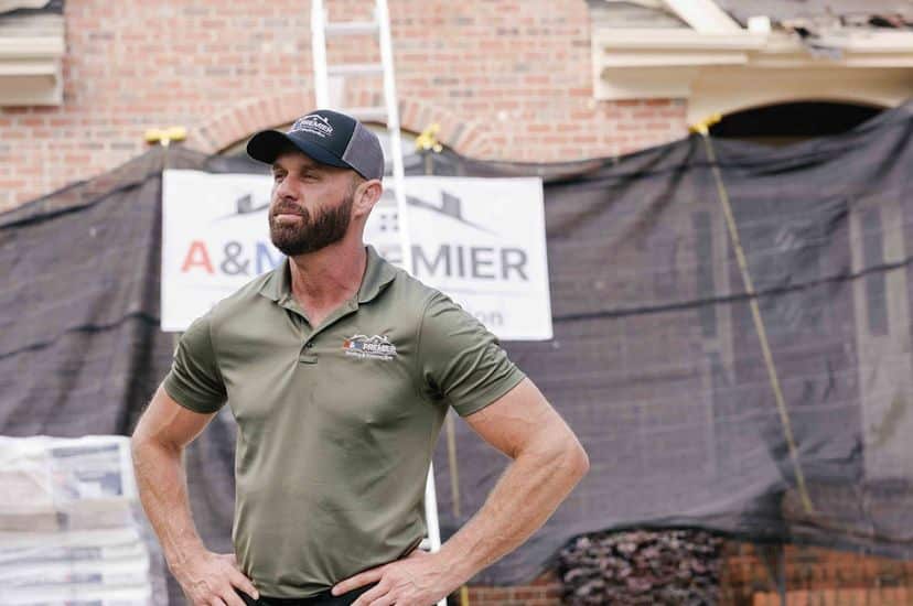 Stephen Mull in front of a roof build