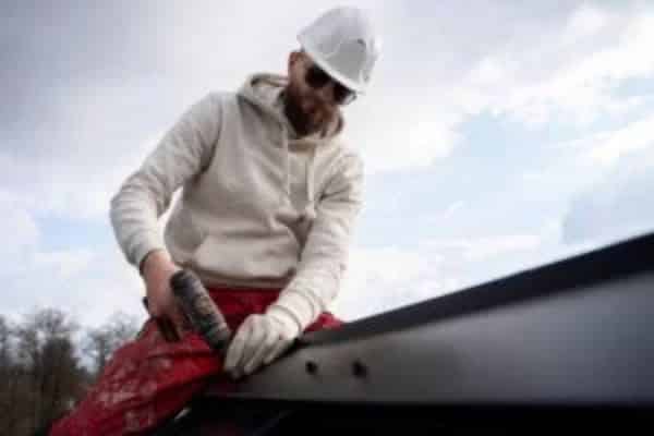 man repairing a roof